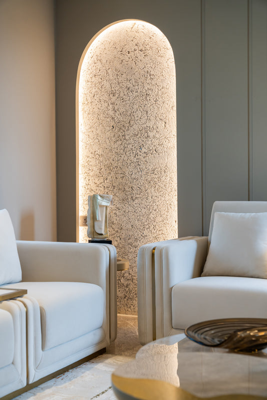 Abstract stone-look art table sculpture with gold accents by Signorini, showcasing modern artistic design and textured surface.
